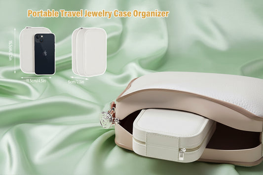 Portable travel jewelry case organizer with dimensions indicated on a light pink background